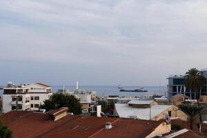 Cyprus,Paphos - May 30, 2023. In the distance, you can see a container ship entering the port of Paphos in the Cyprus Bay photo