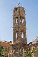 Nicosia,Cyprus - November 03, 2023. Bell tower a part of monastery in the southwest of the island. An important Orthodox pilgrimage site. photo