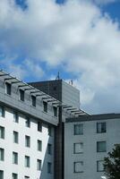 White and grey office buildings in business district. Modern urban architecture under construction. photo