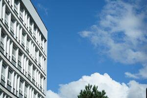 White and grey office buildings in business district. Modern urban architecture under construction. photo