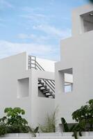 Generic geometric minimalist white architecture on a clear sunny day. photo