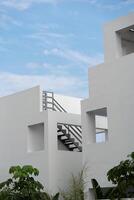 Generic geometric minimalist white architecture on a clear sunny day. photo