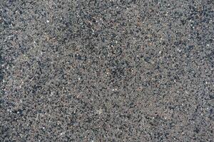 New asphalt texture. A frame filled with the textured surface of dry asphalt, showcasing the detailed pattern photo
