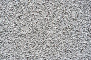 white mortar wall background. Stone plastered stucco wall. Color gray grunge cement backgrounds. Raw concrete texture. top view. photo