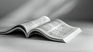 An open book on a white surface photo