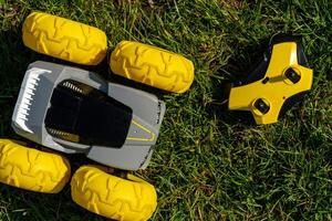 yellow jeep with remote control toy on green grass photo