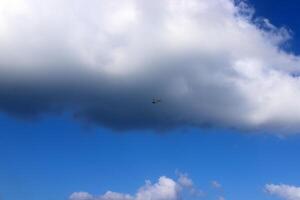 white clouds are floating across the sky photo