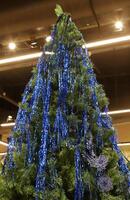 Artificial Christmas trees are sold in a store in Israel photo
