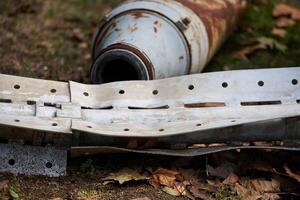 The tail section of a 220 mm rocket for the Uragan rocket fire system on a city flowerbed in Mykolaiv photo
