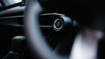 The button for stopping the start of the car engine. Ignition hybrid electric car engine. Banner, advertising, free copy space photo