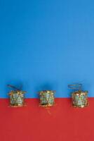 Traditional Christmas decorative drums on a bright blue and red background photo