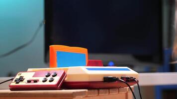 Old game console running a platform videogame on a crt tv video