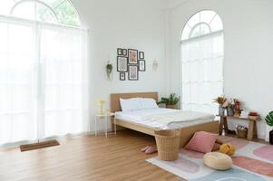 Cozy Bedroom With a Minimalistic Design and Natural Light in a Tranquil Setting photo
