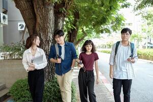 Students Enjoying a Sunny Day While Walking on Campus in the Afternoon photo