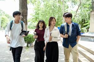 Students Enjoying a Sunny Day While Walking on Campus in the Afternoon photo