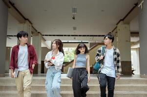 Students Enjoying a Sunny Day While Walking on Campus in the Afternoon photo