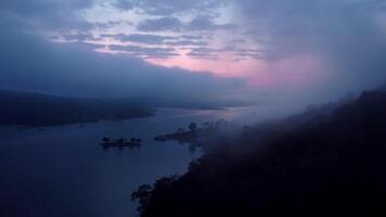 Aerial view of beautiful fog on the lake in the morning. Fresh early morning in the forest near the river. Beautiful sunrise in the forest with fog. video
