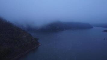 Aerial view of beautiful fog on the lake in the morning. Fresh early morning in the forest near the river. Beautiful sunrise in the forest with fog. video