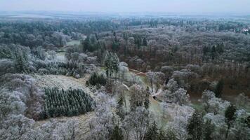 Aerial orbiting view of park and frozen trees in Czechia in December 2024 video