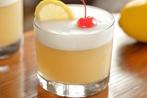 Whiskey Sour Cocktail with Lemon and Cherry on Bar Top photo
