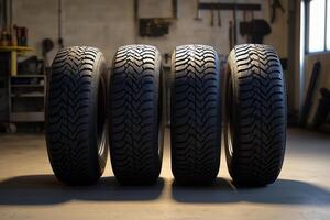 Set of four new robust tires with deep treads ready for installation photo