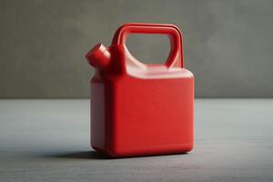 Modern red gasoline canister with spout and ergonomic molded handles photo