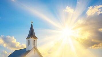 Church Tower with Cross and Sun Behind Creating Lens Flare photo