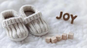 Tiny Baby Booties on Soft Carpet with Play Cubes Reading Joy Highlighting Innocence photo