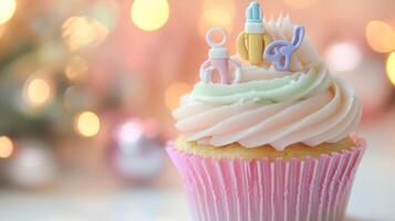 Pastel Cupcake Decorated with Newborn Items for Baby Celebration photo
