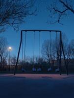 Empty Swings in Deserted Playground photo