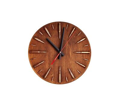 A unique wall clock with a wooden face, featuring bullet casings as hour markers, and black and red clock hands, blending rustic and military aesthetics, isolated on a white back photo
