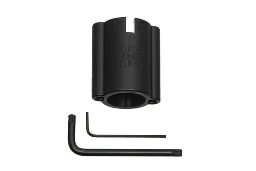 Black plastic tool with 'PUSH AND TURN' text, two L-shaped hex keys, isolated on white background. photo