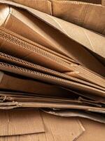 Close-up view of stacked corrugated cardboard layers, showcasing the intricate wave structure and texture, ideal for concepts like packaging, recycling, industry, and material design photo