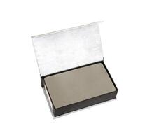 Open black case with a gray foam insert, white textured background. photo