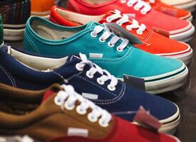 A variety of colorful canvas sneakers are displayed in a store, showcasing different styles and vibrant colors. photo