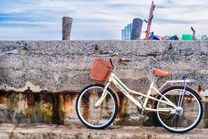 Early Morning Scene with Bicycles Resting at a Peaceful Fishing Port by the Ocean at Chonburi, Thailand. photo
