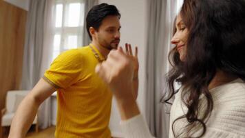 Dancing practice session between a couple in a cozy indoor setting video