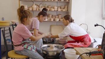 Learning pottery techniques in a clay studio with expert guidance video