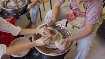 Creating pottery together in a pottery workshop on a sunny afternoon video