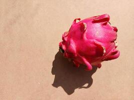 Dragon fruit isolated on yellow background photo