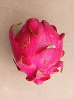 Dragon fruit isolated on yellow background photo