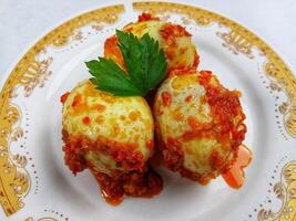 Egg Balado. Balado is a type of hot and spicy bumbu spice mixture found in Indonesian cuisine. Balado sauce is made by stir frying ground red hot chili pepper with other spices photo