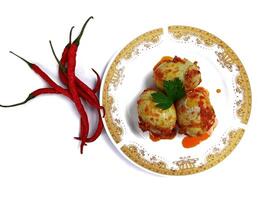 Egg Balado. Balado is a type of hot and spicy bumbu spice mixture found in Indonesian cuisine. Balado sauce is made by stir frying ground red hot chili pepper with other spices photo