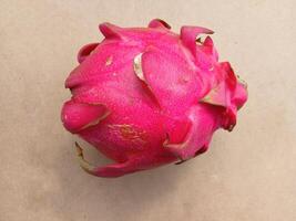 Dragon fruit isolated on yellow background photo