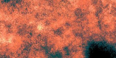A textured abstract background in vibrant orange tones with black speckled patterns, ideal for creative designs. photo