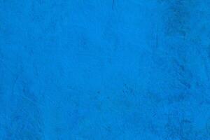 Bright blue texture with natural rough patterns and subtle imperfections, ideal for creative backgrounds or designs. photo