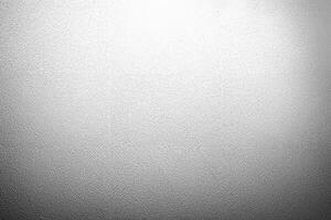 Simple white textured surface with a subtle grainy pattern, perfect for backgrounds, designs, or overlays. photo