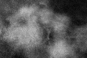 High-contrast black and white abstract texture with a grainy noise effect, ideal for backgrounds and overlays. photo