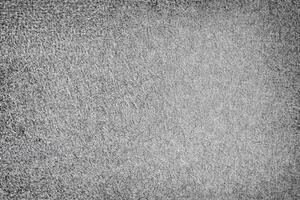 A high-contrast gray background with a fibrous, rough texture, perfect for industrial, abstract, or minimalist designs. photo