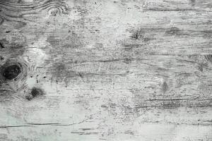 Rustic wooden texture background featuring weathered surface, natural grain, knots, and distressed patterns. photo